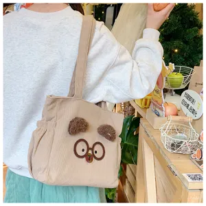 Cute corduroy lunch bag with cartoon bear ears and glasses, stylish daily tote for women.
