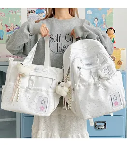 Japanese style star print white school backpack and tote bag set with cute plush pendants for teens.