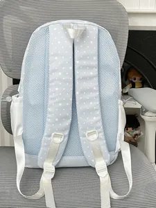 Light blue backpack with cute white star pattern, breathable mesh straps, and adjustable web