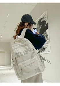 Stylish white star pattern backpack with large capacity, perfect for daily school use.