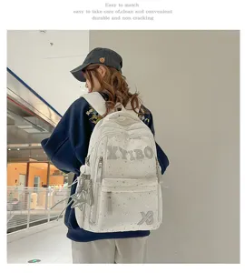 White star print canvas backpack for students, large capacity casual school bag for daily use.