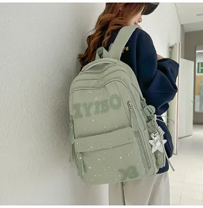 Large capacity school backpack for students with star pattern and cute pendant detail.