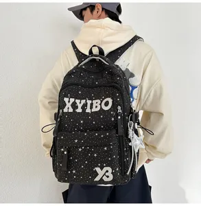 Stylish star print canvas backpack with large capacity for school students and daily use.