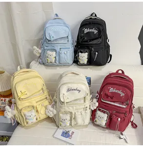 Zaino per studenti in stile giapponese grande capacità zaino tinta unita con bambola carina