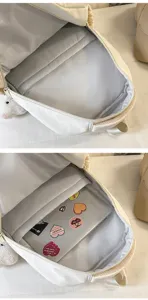 Backpack interior detail showing spacious compartment and laptop sleeve with neat lining.