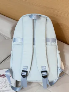 Casual light blue backpack for women, stylish school bag with shoulder straps and buckles.