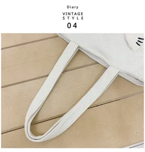 Cute cartoon corduroy lunch bag for women, white bento tote bag with lovely cat design details.
