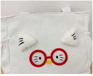 White corduroy lunch bag with cute cartoon cat ears and red glasses detail for daily use.