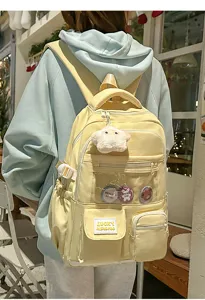 Casual light yellow school backpack with multiple pockets transparent window and plush star pendant.