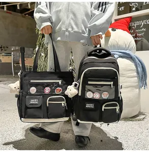 Black school backpack and tote bag two-piece set with clear window and cute pin badges.