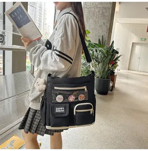 Korean style canvas crossbody shoulder bag for students with multi pockets and clear display pocket.