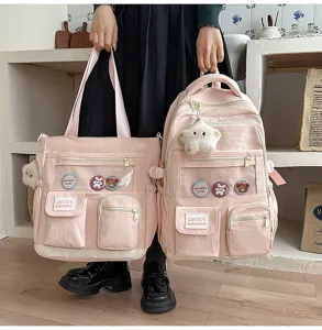 Pink canvas student backpack and tote bag set with clear front pockets and cute badges.