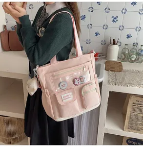 Pink student tote bag with clear PVC front pocket, multi-pocket casual canvas shoulder bag for school