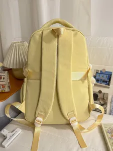 Yellow school backpack rear view, stylish casual student bookbag for daily outdoor.