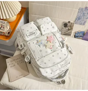 Detailed view of the cute white star pattern ita backpack with multi pockets and plush star decor.