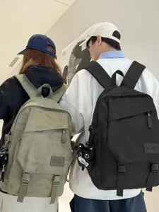 Stylish couple backpack with dark camouflage pattern, lightweight multi-purpose casual daypack.