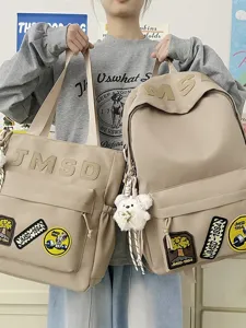Korean style minimalist canvas backpack and shoulder tote bag set for daily student use.
