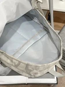 Lightweight grey camo casual backpack with spacious interior compartment and smooth zipper opening.