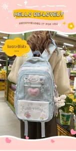 Sweet style school backpack detail view, featuring cute plush charm and mesh front pocket.