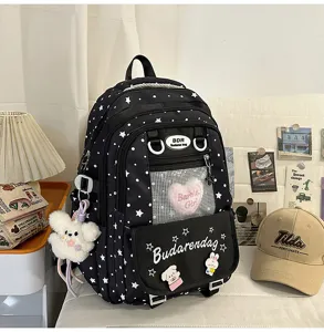 Japanese sweet style black star backpack with mesh pocket and cute plush pendants, ideal for students.