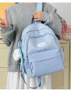 Light blue star print school backpack with front pocket, cute student casual daypack for teens.