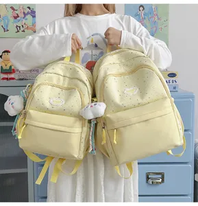 Cute star print canvas backpack for women and teens, casual school daypack with cloud pendant.