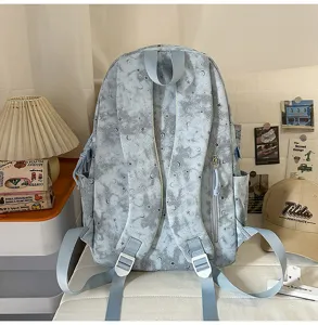 Detailed view of the stylish Japanese style star and moon pattern backpack with shoulder straps.