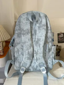 Korean style minimalist student backpack with cute star moon print for school daily use.