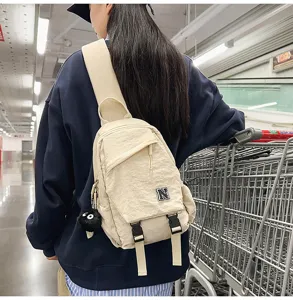 Unisex casual canvas sling chest bag in beige detail view, perfect for daily wear and sports.