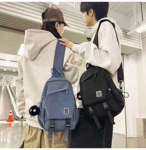 Unisex casual sling chest bag with stylish letter patch and cute pendant, ideal for daily wear.