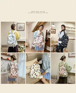 Korean style cute polka dot backpack with plush pendant, lightweight daily school bag.