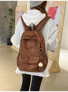 Zaino casual marrone in camoscio da donna, borsa scolastica vintage minimalista.