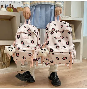 Cute pink leopard print school backpack for teens, sweet style lightweight travel daypack.