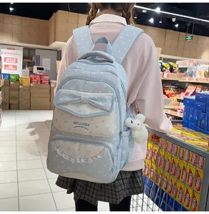 Mignon sac à dos bleu clair à pois avec nœud et dentelle pour filles, cartable élégant.