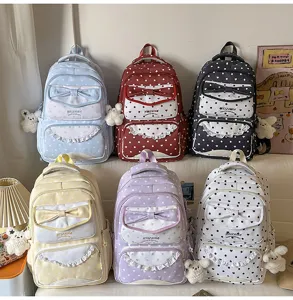 Sac à dos mignon à pois et nœud pour filles, cartable kawaii multicolore pour étudiantes.