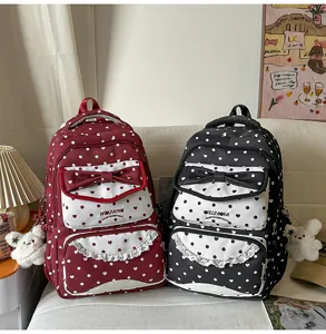 Sac à dos mignon à pois avec nœud pour filles, cartable esthétique tendance printemps.