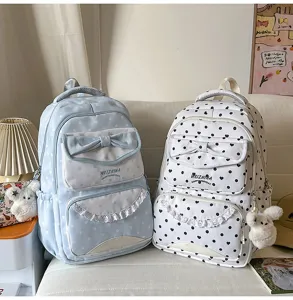 Joli sac à dos cartable à pois pour filles ados avec nœud et style doux quotidien.
