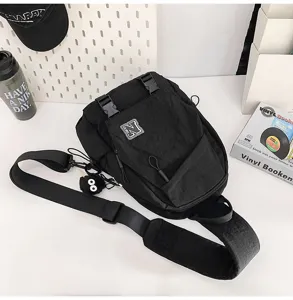 Unisex black tactical sling bag casual chest bag with wide strap and durable nylon fabric.