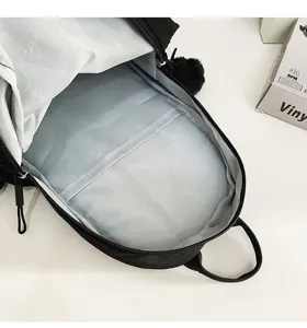 Detail view of black casual backpack interior lining, featuring clean compartments and durable fabric design.
