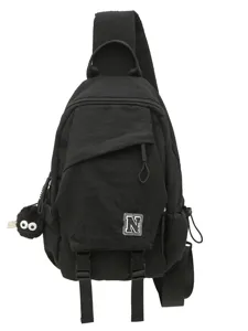 Unisex black casual sling bag crossbody chest backpack with cute pendant and stylish N patch.