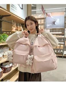 Sweet pink polka dot student backpack with cute bear pendant for daily travel and school use style