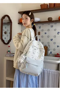 Cute cartoon cat graffiti backpack for women, large capacity stylish student school bag.
