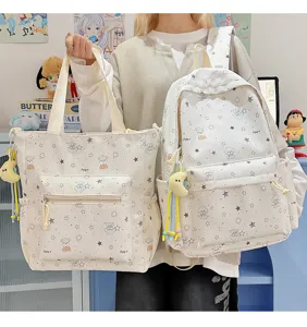 Close-up of the cute star print backpack and tote bag set with lovely pendant details.