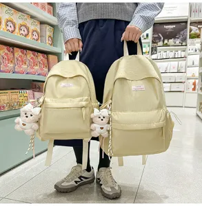 Cute Japanese polka dot school backpack for women and students with lovely bear pendant sweet style.