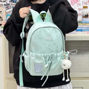 Cute mini student backpack with star pattern and plush pendant for daily school and travel use