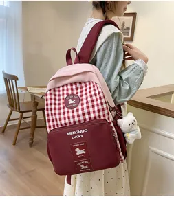 Japanese sweet plaid backpack, lightweight large capacity school bag with cute bear pendant.