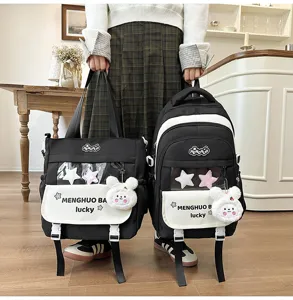 Detail view of black white student backpack tote set with clear window plush bunny pendant.