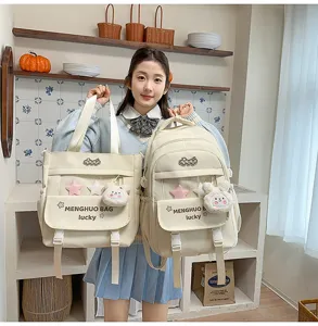 Chic cream white school backpack and tote bag set with cute plush charms and star accents.