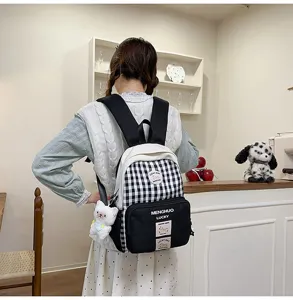Detailed view of sweet Japanese style black and white checkered backpack for daily use.