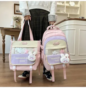 Cute color-blocked multi-compartment school backpack and tote bag set with plush rabbit.